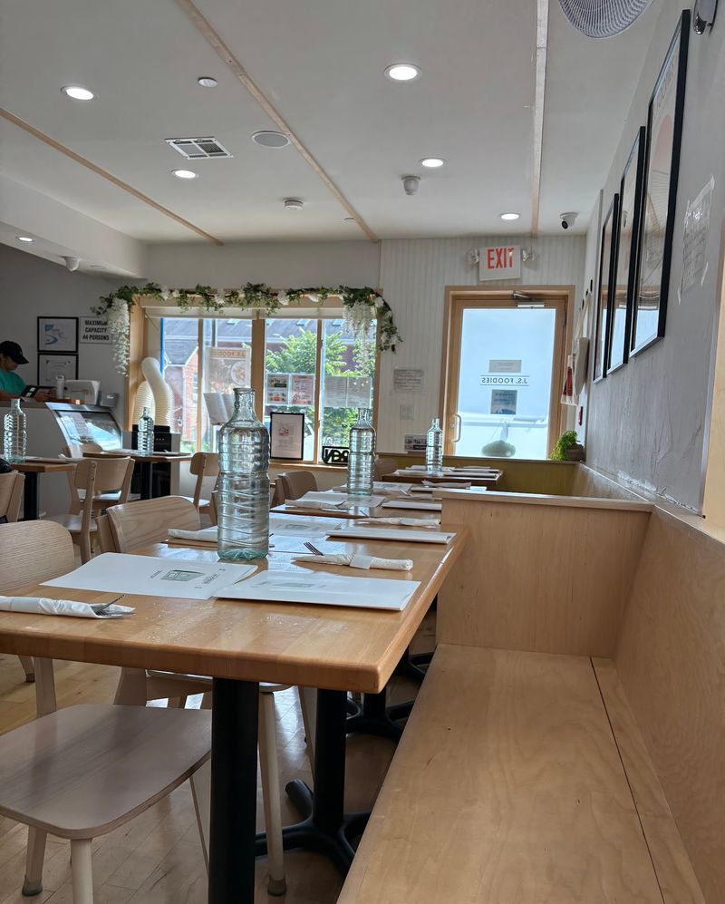 A Bright Open Dining Room Makes the Small Cafe Feel Warm and Welcoming A Bright Open Dining Room Makes the Small Cafe Feel Warm and Welcoming