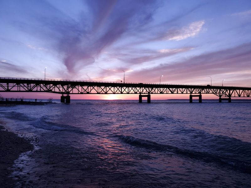 Bridge lights, black water, and a sky full of contrast Bridge lights, black water, and a sky full of contrast