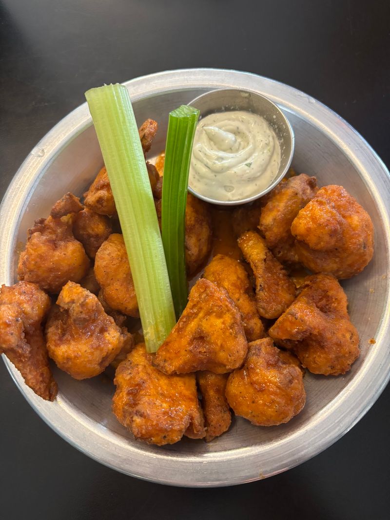 Buffalo cauliflower, tots, and comfort food with real swagger Buffalo cauliflower, tots, and comfort food with real swagger