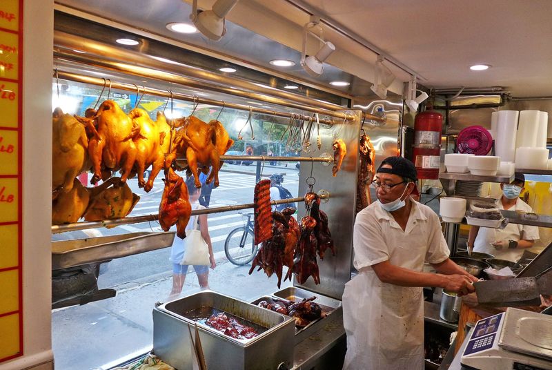 Roast Meats Hanging Behind The Counter
