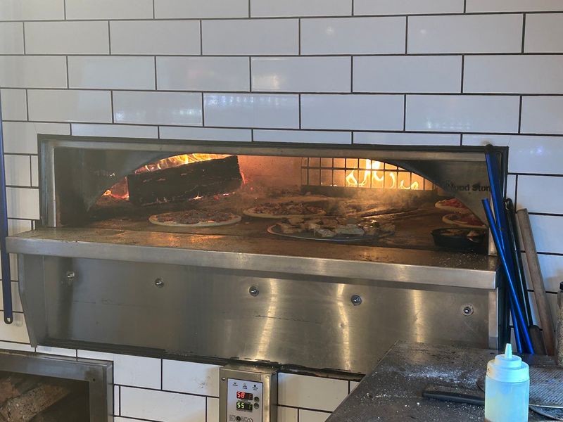 The Wood-Fired Oven Is the Heart of the Kitchen