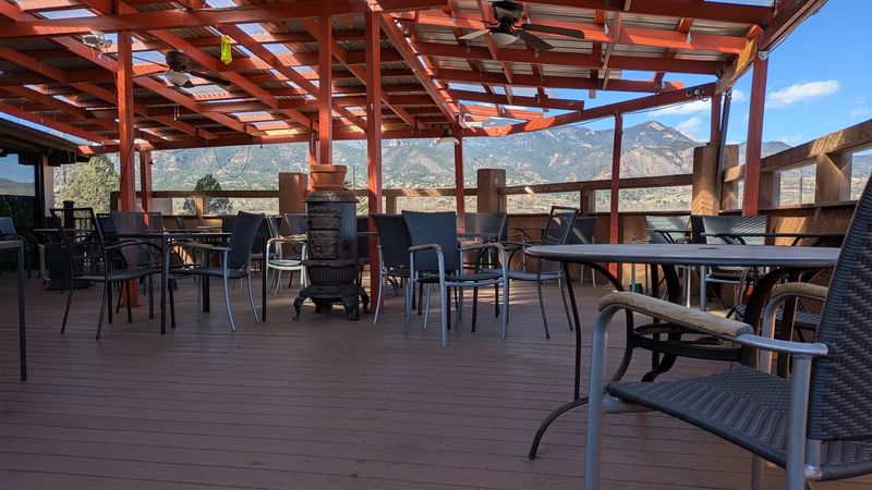 A Patio Table With Mountains In View