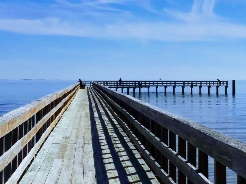 A Fishing Pier With Sunset Views