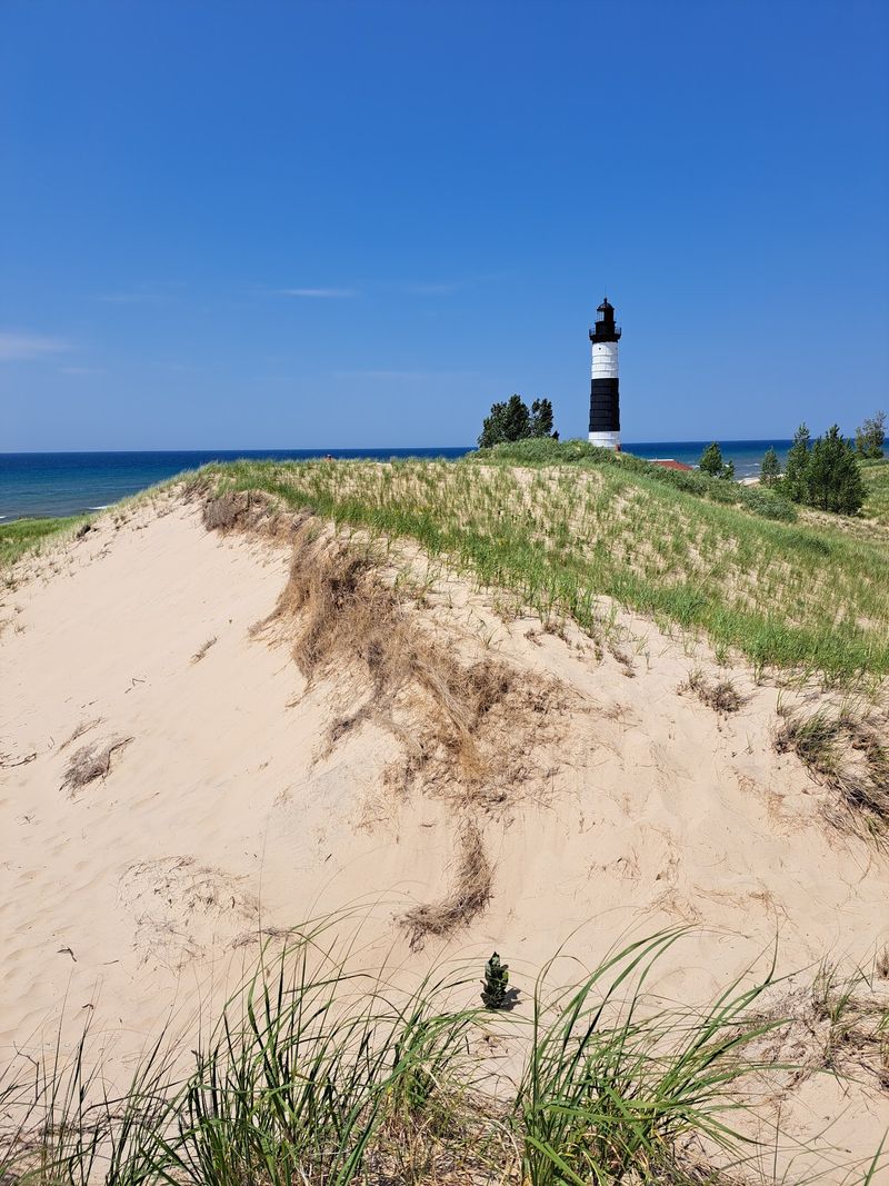A Striped Tower Beyond the Dunes