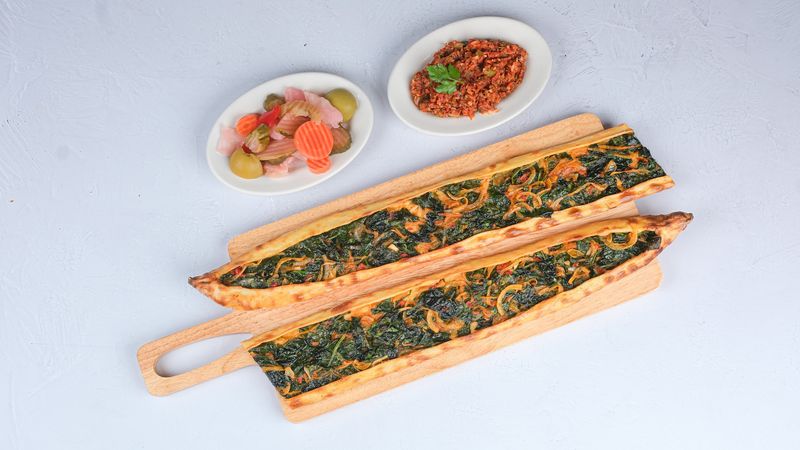 Boat-Shaped Pide Comes Bubbling From the Stone Oven Boat-Shaped Pide Comes Bubbling From the Stone Oven