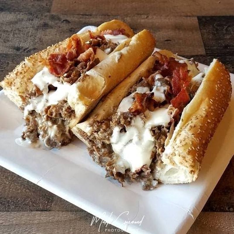 Every Cheesesteak Starts With 12 Ounces of Shaved Ribeye Every Cheesesteak Starts With 12 Ounces of Shaved Ribeye