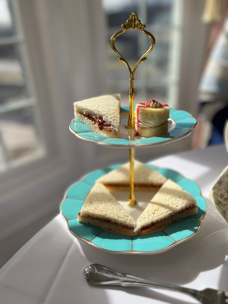 Finger Sandwiches and Miniature Desserts Fill the Tiered Trays