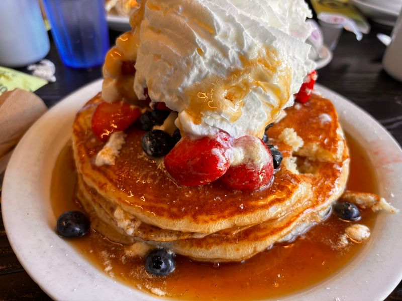 Pancakes Arrive Stacked, Stuffed, and Almost Too Big for the Table Pancakes Arrive Stacked, Stuffed, and Almost Too Big for the Table