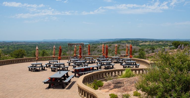 These 7 Texas Wineries Have Porches With Views Straight Across the Vineyard Rows