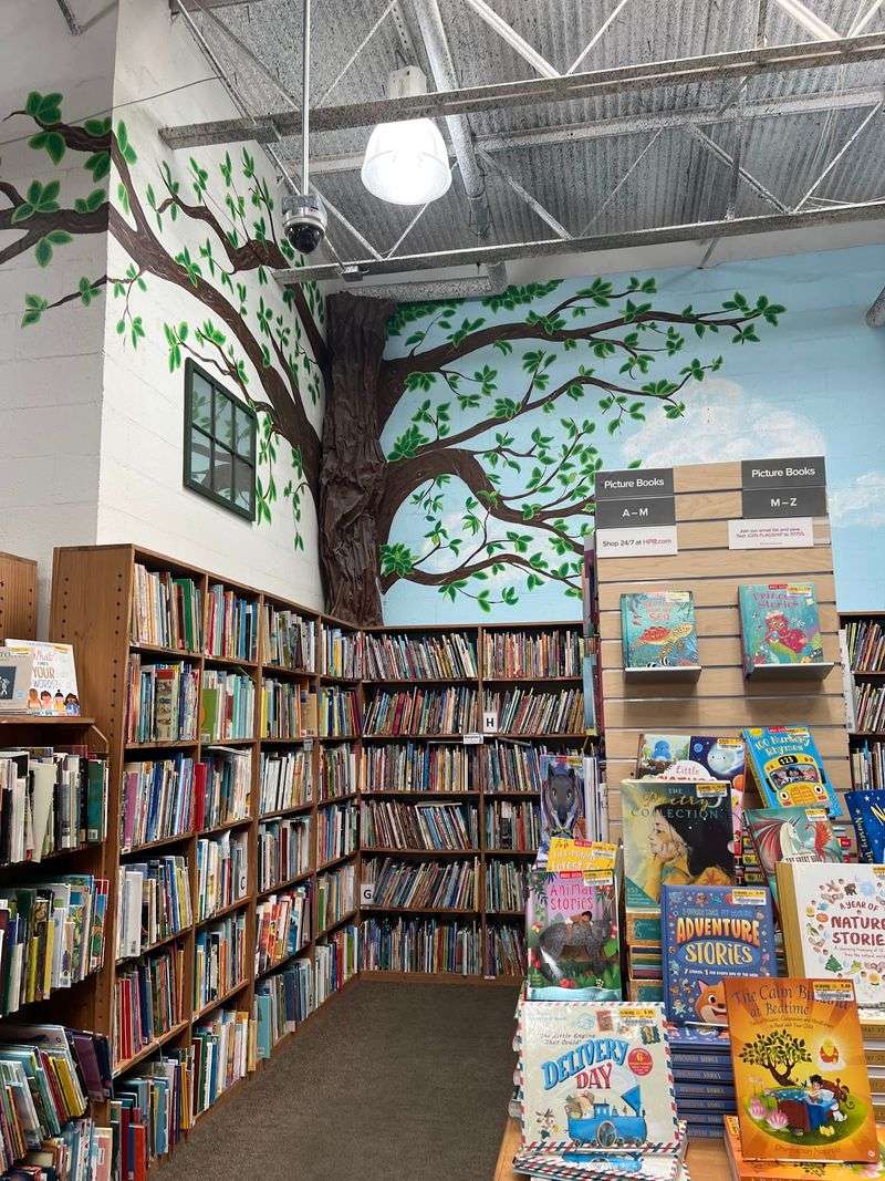 A Kids Area With a Tree and a Play House