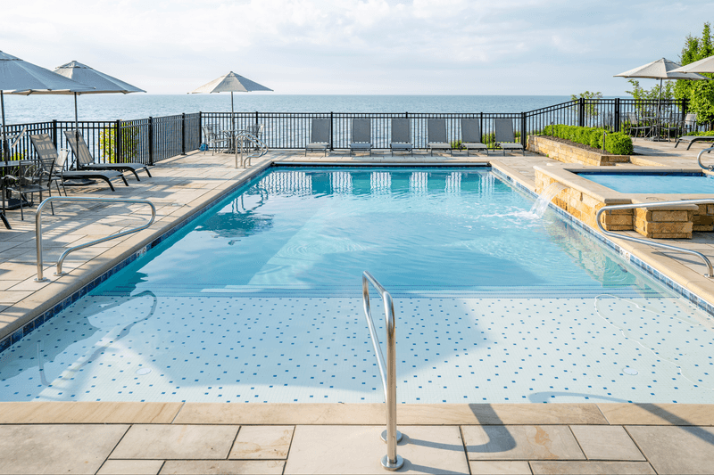 A Pool With a Lakefront Backdrop