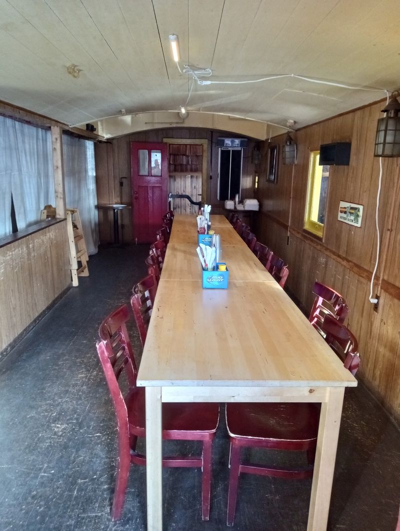Dinner Seating Inside a Full-Size Caboose