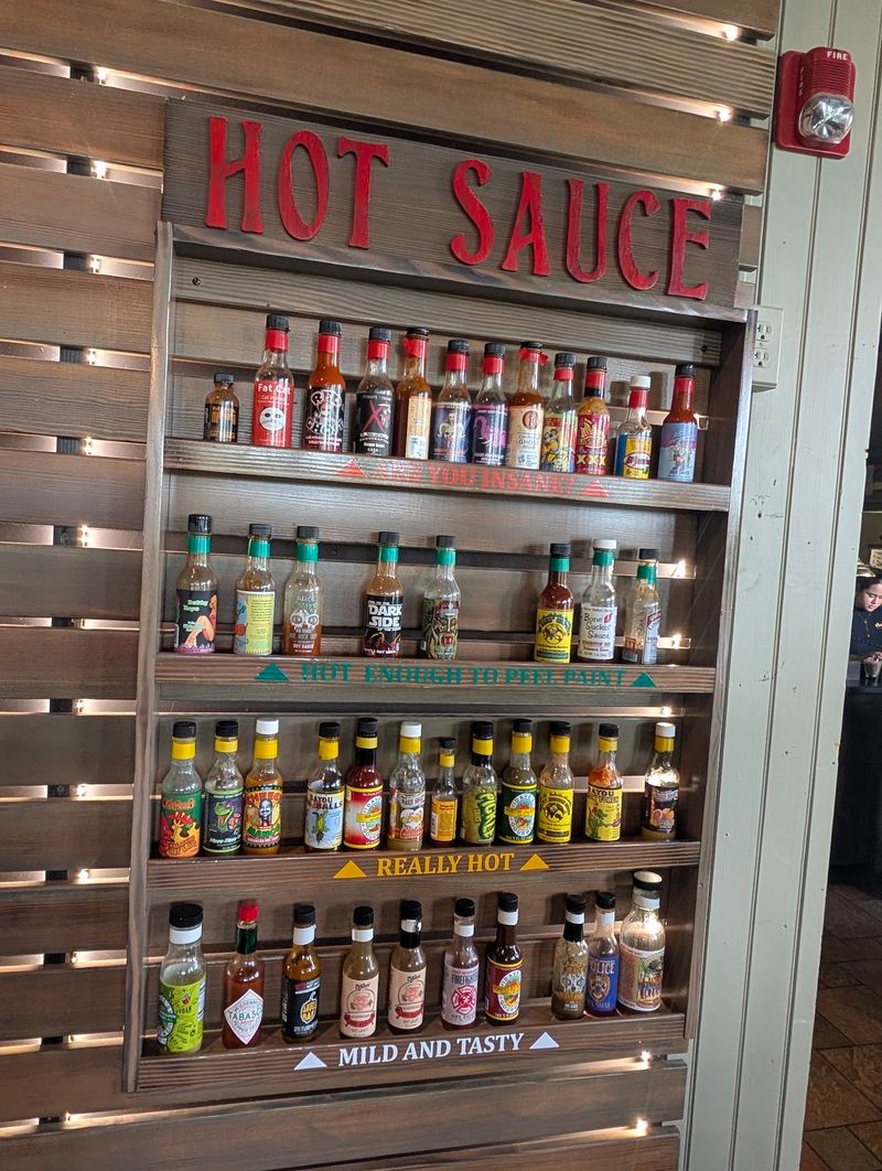 Grab A Bottle Off The Hot Sauce Wall And Start Experimenting