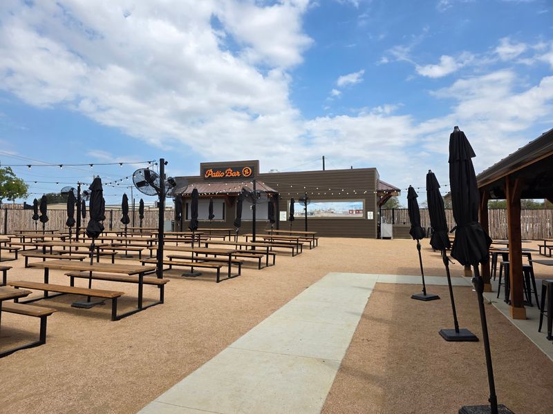 Live Music and Cornhole Wait Outside