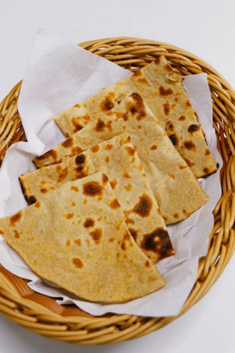 The Garlic Naan Deserves Its Own Seat At The Table The Garlic Naan Deserves Its Own Seat At The Table