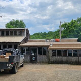Near Sallisaw, This Leaning Tin-Roofed Shack Has Smoked Hickory Ribs And Thick Bologna Since The 1960s