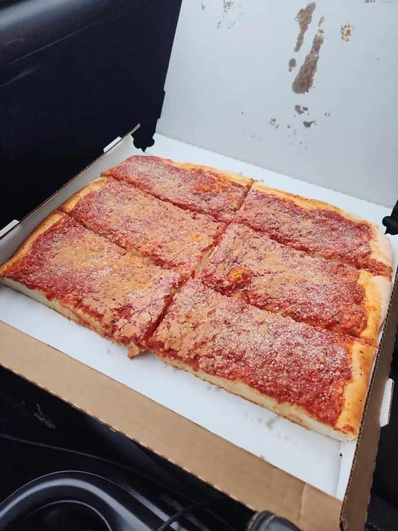 The Morning Pizza Rush Starts Before the Trays Do